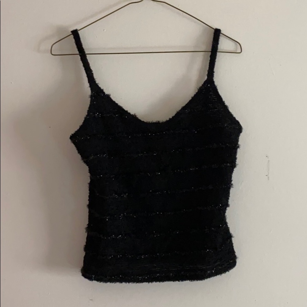A black crop top , with fur and sparkles